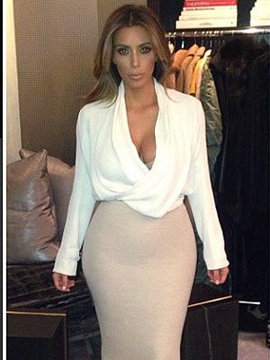 Kim Kardashian suffers TWO NSFW wardrobe malfunctions as she shows off  curves in see-through white top & leggings