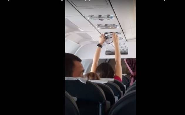 Watch Video: Women dries underwear under the AC vent in packed flight