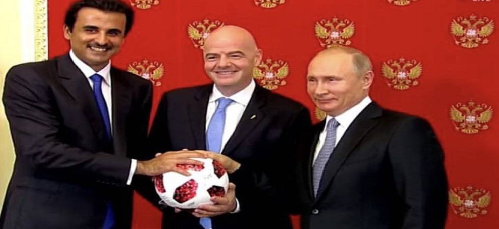 Russian President Vladimir Putin passes torch to Qatar for World Cup 2022